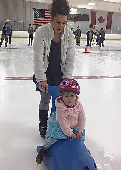 mother and daughter skating at the pond family friendly ice rink in chagrin falls ohio