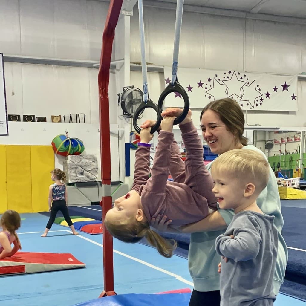 Mom with toddler and preschooler in gymnastics class