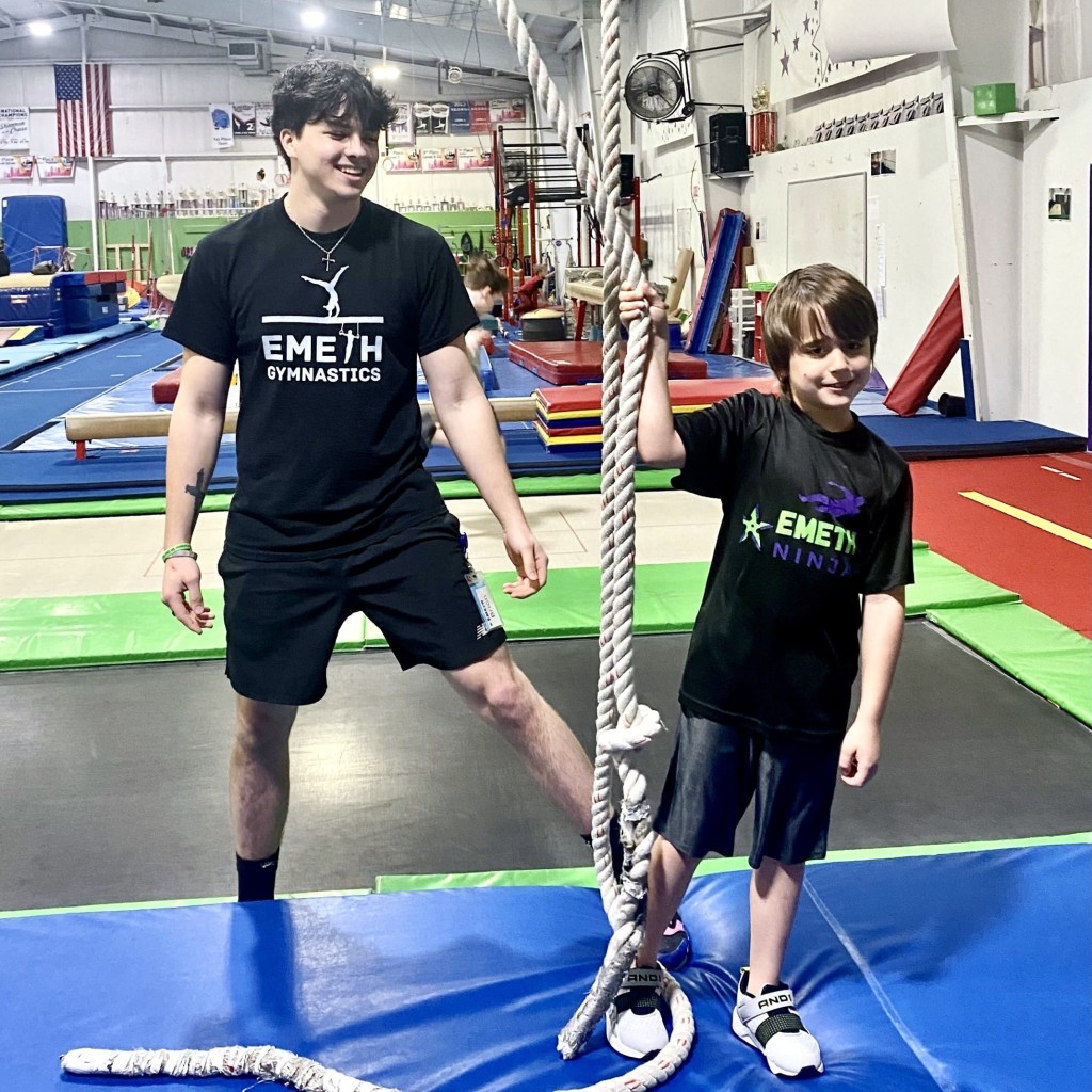 Ninja coach with boy at EmethGym