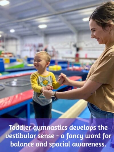 Mom and toto in toddler gymnasics class on beam Mom and tot in toddler gymnasics class on beam