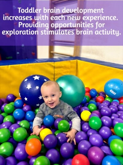 Toddler playing in ball pit during gymnastics