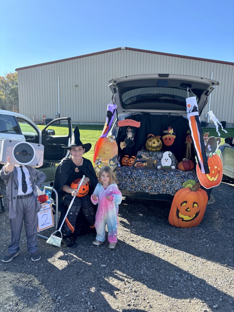 Trunk or Treat 2025 Family with decorated trunk at Trunk or Treat event