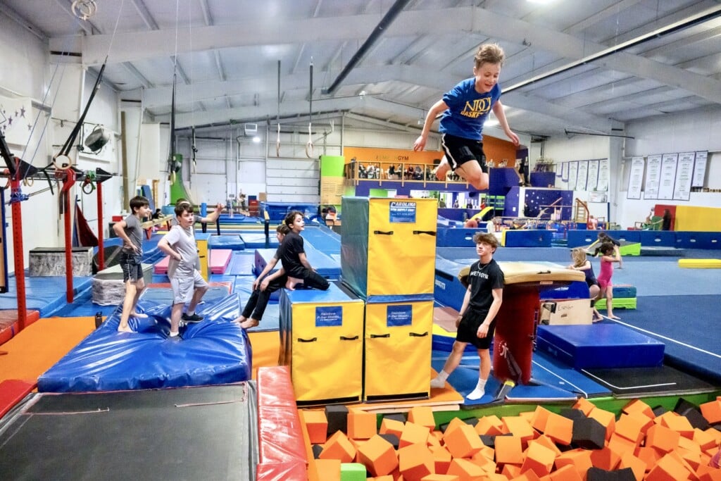 Kids jumping into a foam pit Kids jumping into a foam pit