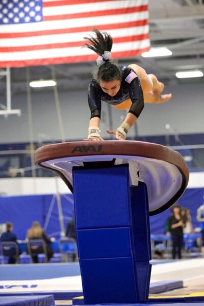 gymnast in first flight phase of vault